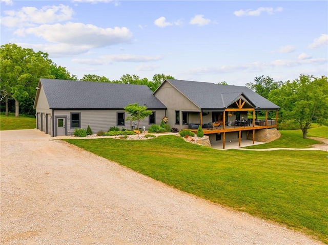 31788 W 223rd St, Spring Hill, KS 66083 - view of front of property with dirt driveway, a garage, a front yard, and a deck