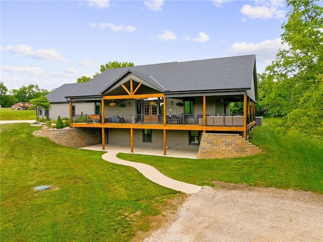 31788 W 223rd St, Spring Hill, KS 66083 - back of property with a patio area, a lawn, a deck, and roof with shingles