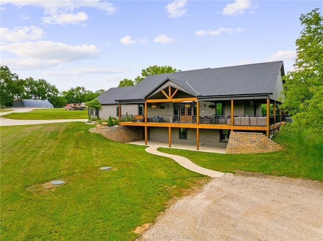 31788 W 223rd St, Spring Hill, KS 66083 - view of front facade featuring a front lawn, a deck, a patio, and a shingled roof