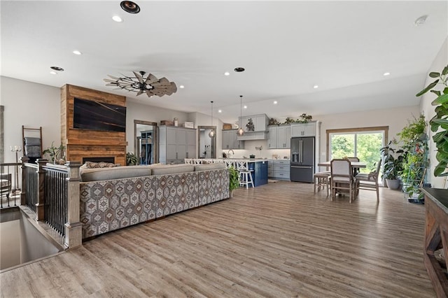 31788 W 223rd St, Spring Hill, KS 66083 - living area with wood finished floors, recessed lighting, and a fireplace