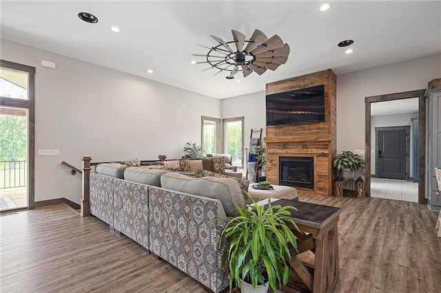 31788 W 223rd St, Spring Hill, KS 66083 - living room featuring recessed lighting, wood finished floors, and a large fireplace