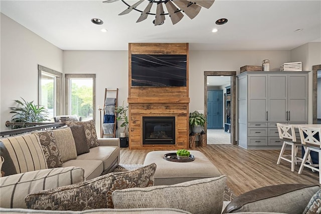 31788 W 223rd St, Spring Hill, KS 66083 - living room with a ceiling fan, light wood-style floors, recessed lighting, and a large fireplace