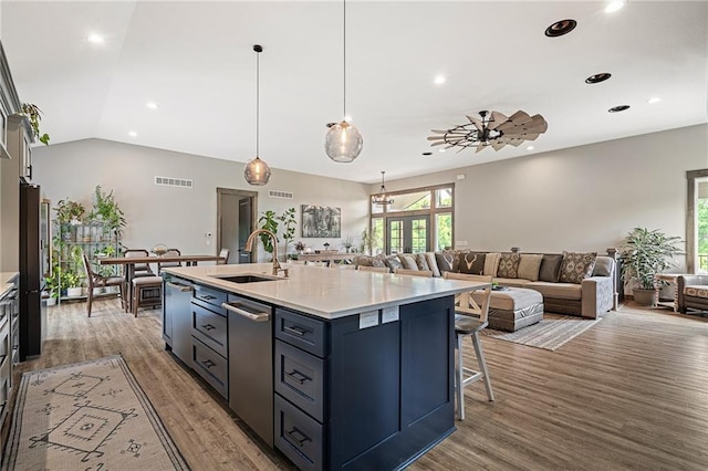31788 W 223rd St, Spring Hill, KS 66083 - kitchen featuring stainless steel dishwasher, recessed lighting, wood finished floors, open floor plan, and an island with sink
