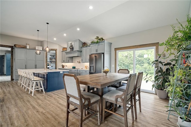 31788 W 223rd St, Spring Hill, KS 66083 - dining room with healthy amount of natural light, light wood-style flooring, lofted ceiling, and recessed lighting