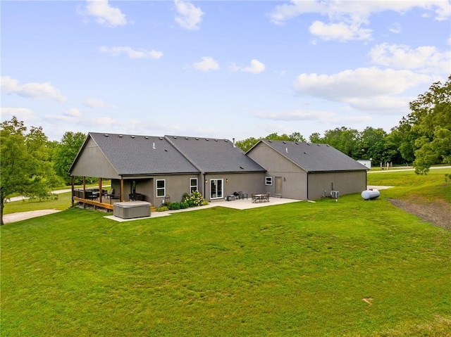 31788 W 223rd St, Spring Hill, KS 66083 - rear view of house with a hot tub, a patio area, and a lawn