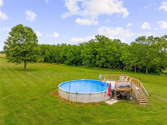 31788 W 223rd St, Spring Hill, KS 66083 - swimming pool with a lawn, a wooden deck, and stairway