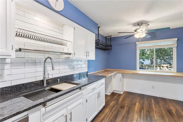 10017 W 95th St, Overland Park, KS 66212 - kitchen featuring decorative backsplash, white cabinets, and a textured ceiling