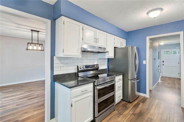 10017 W 95th St, Overland Park, KS 66212 - kitchen with under cabinet range hood, appliances with stainless steel finishes, a textured ceiling, dark wood-style floors, and white cabinetry