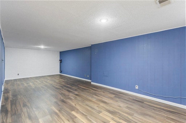 10017 W 95th St, Overland Park, KS 66212 - unfurnished room with wood finished floors and a textured ceiling
