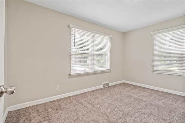 8710 Craig Dr, Overland Park, KS 66212 - carpeted empty room featuring baseboards