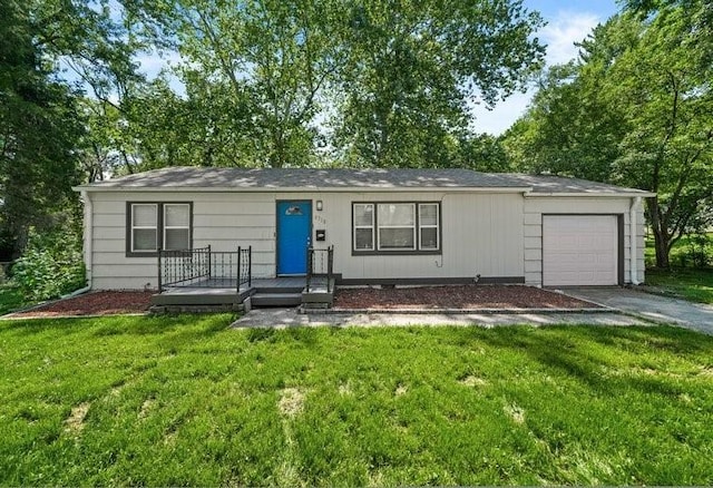 8710 Craig Dr, Overland Park, KS 66212 - ranch-style house with concrete driveway, a garage, and a front yard