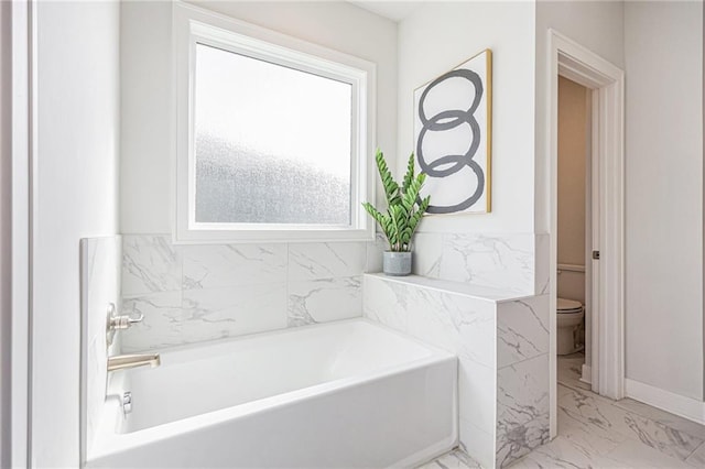 20854 W 190th Pl, Spring Hill, KS 66083 - bathroom with marble look tile flooring and a bath