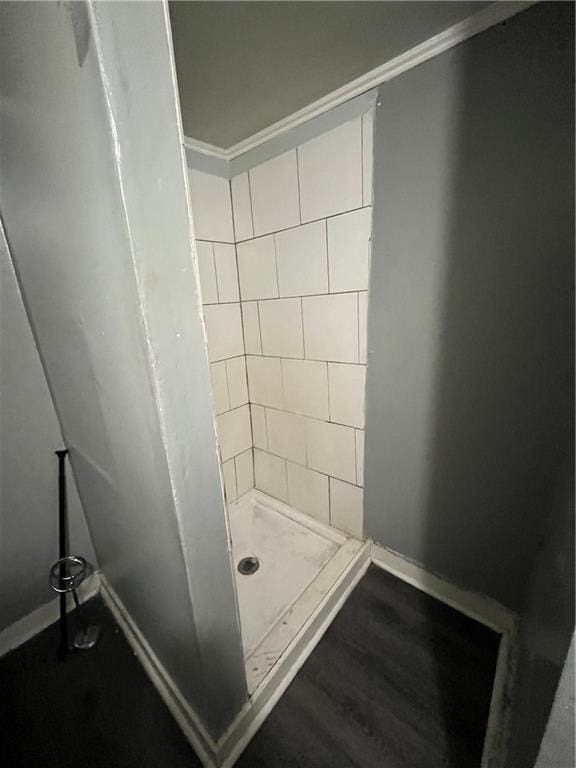 11300 E 29th St, Independence, MO 64052 - bathroom with a stall shower, wood finished floors, and ornamental molding
