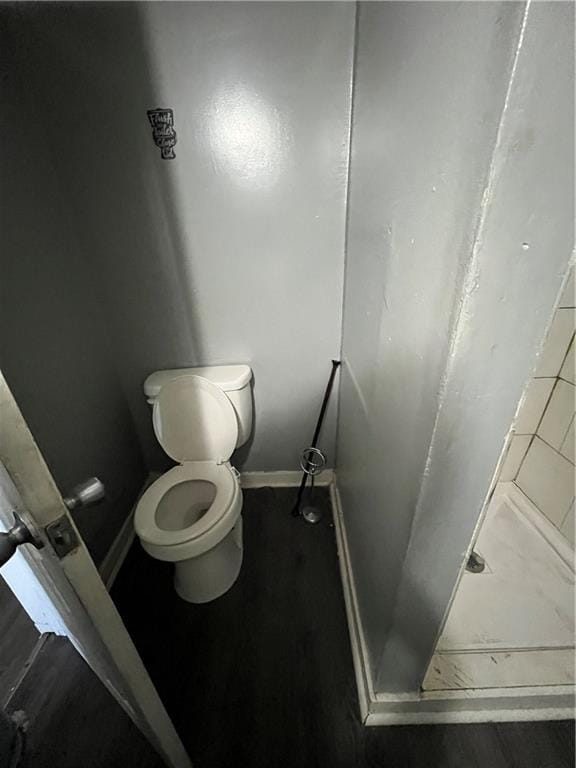 11300 E 29th St, Independence, MO 64052 - bathroom with a stall shower and wood finished floors