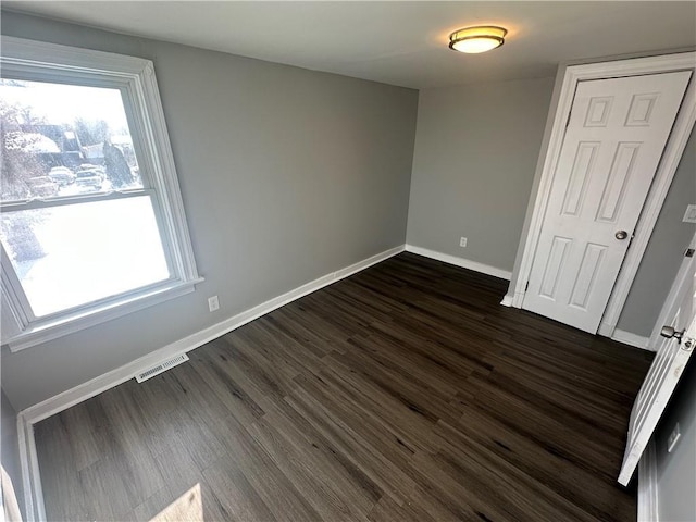 11300 E 29th St, Independence, MO 64052 - unfurnished bedroom featuring dark wood finished floors