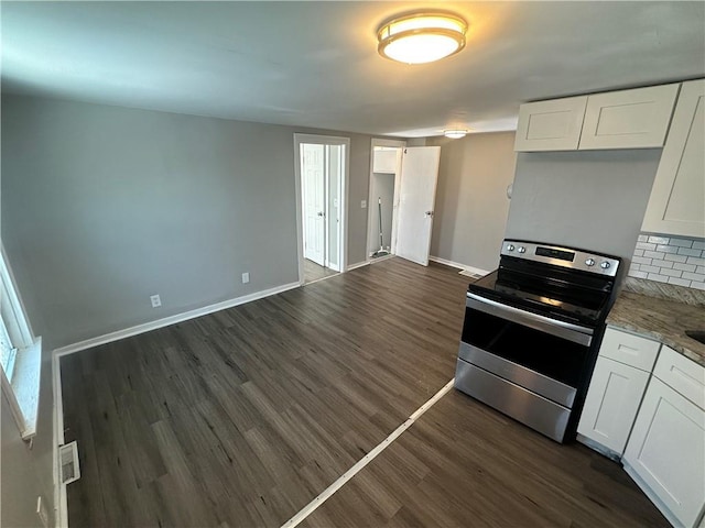 11300 E 29th St, Independence, MO 64052 - kitchen with stainless steel range with electric cooktop, dark wood-type flooring, white cabinets, and light stone countertops