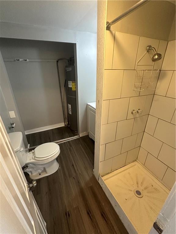 11300 E 29th St, Independence, MO 64052 - bathroom with water heater, wood finished floors, and a shower stall