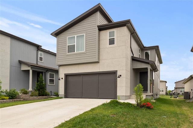 13333 W 180th St, Overland Park, KS 66013 - contemporary home featuring a garage, a front lawn, concrete driveway, and stucco siding