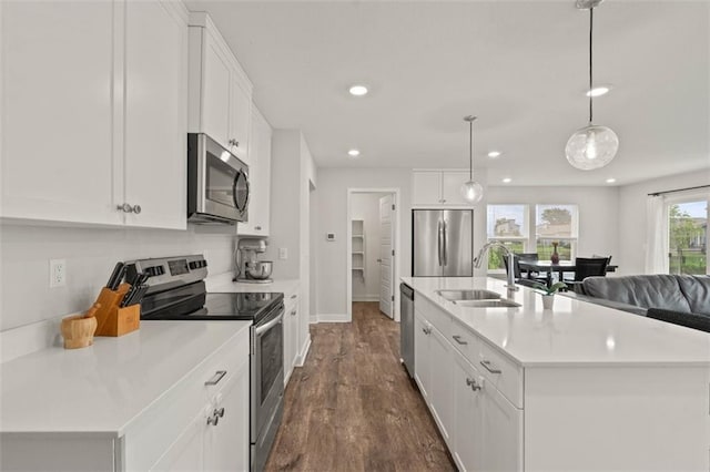 13333 W 180th St, Overland Park, KS 66013 - kitchen featuring appliances with stainless steel finishes, dark wood-style flooring, white cabinets, recessed lighting, and light countertops