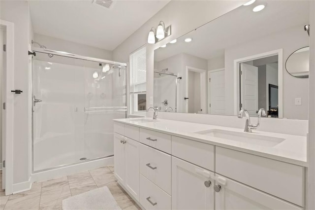 13333 W 180th St, Overland Park, KS 66013 - full bath featuring a stall shower, double vanity, marble look tiles, and recessed lighting