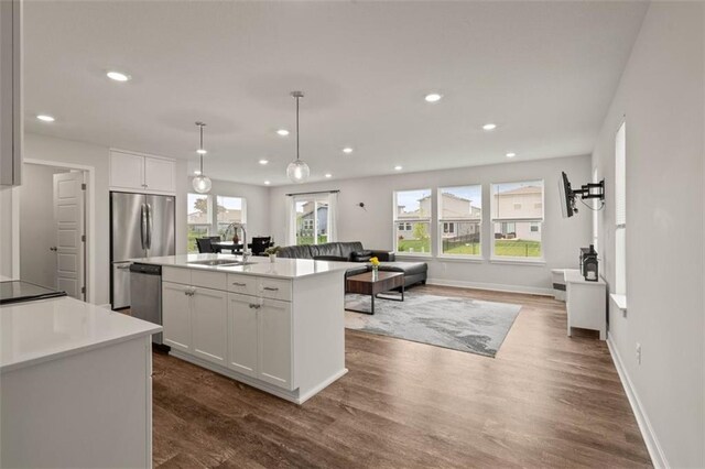 13333 W 180th St, Overland Park, KS 66013 - kitchen with stainless steel appliances, plenty of natural light, recessed lighting, white cabinets, and open floor plan