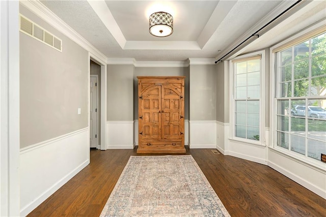 14010 Ash St, Overland Park, KS 66224 - entryway with a raised ceiling, dark wood-type flooring, and wainscoting