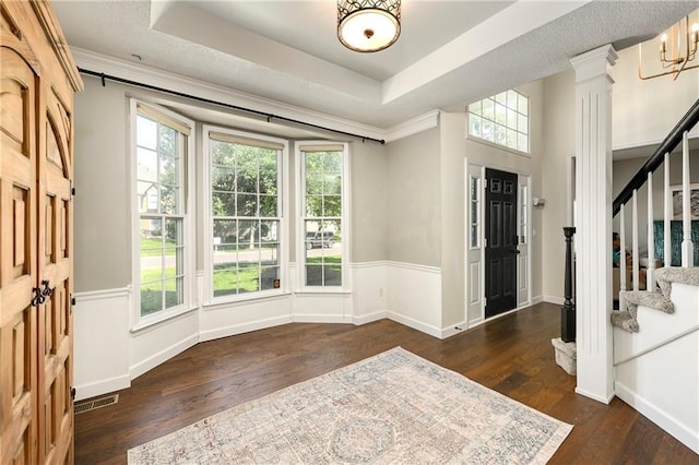 14010 Ash St, Overland Park, KS 66224 - foyer entrance with stairs, plenty of natural light, wood-type flooring, a tray ceiling, and crown molding