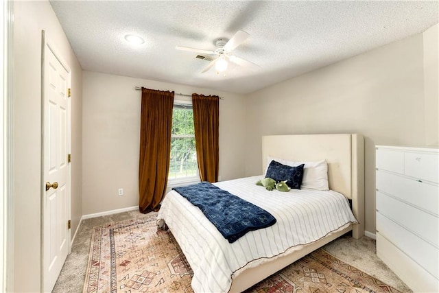 14010 Ash St, Overland Park, KS 66224 - bedroom with light carpet, a textured ceiling, and ceiling fan
