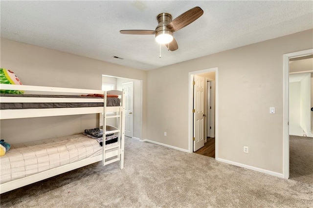 14010 Ash St, Overland Park, KS 66224 - carpeted bedroom featuring baseboards and a textured ceiling