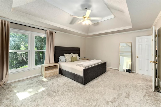 14010 Ash St, Overland Park, KS 66224 - carpeted bedroom featuring a raised ceiling, multiple windows, and ceiling fan