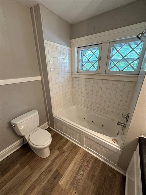 726 N River Blvd, Independence, MO 64050 - full bathroom featuring a tub with jets and wood finished floors
