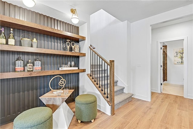 17404 Crystal St, Overland Park, KS 66221 - staircase featuring a bar and wood finished floors