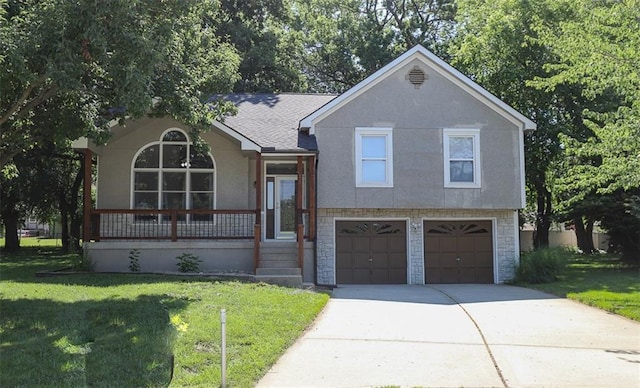311 NE Bridge Pl, Blue Springs, MO 64014 - split level home featuring an attached garage, a front yard, stucco siding, driveway, and a porch