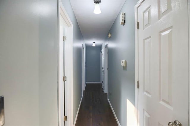311 NE Bridge Pl, Blue Springs, MO 64014 - corridor with dark wood finished floors and baseboards