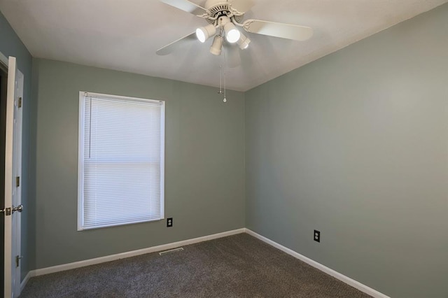 311 NE Bridge Pl, Blue Springs, MO 64014 - spare room featuring dark carpet and ceiling fan