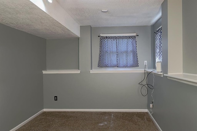 311 NE Bridge Pl, Blue Springs, MO 64014 - carpeted empty room with a textured ceiling