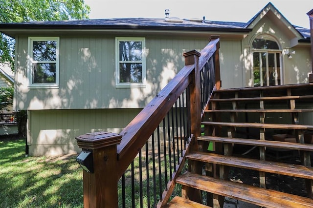 311 NE Bridge Pl, Blue Springs, MO 64014 - back of property featuring stairway and a wooden deck