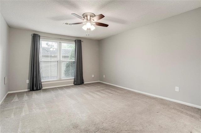 10734 Glenwood St Unit A, Overland Park, KS 66211 - empty room featuring a ceiling fan, carpet, and a textured ceiling