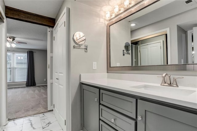 10734 Glenwood St Unit A, Overland Park, KS 66211 - bathroom featuring vanity, ceiling fan, and marble look tiles