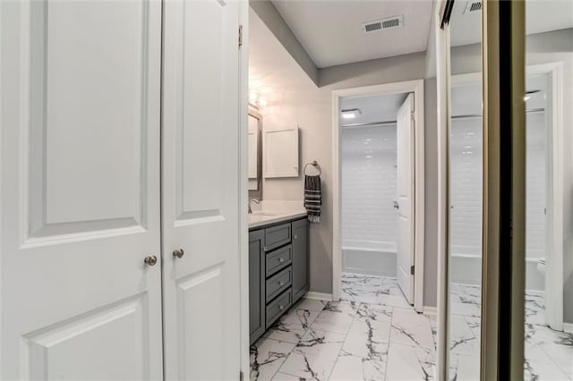 10734 Glenwood St Unit A, Overland Park, KS 66211 - full bathroom with marble finish floors, vanity, and washtub / shower combination