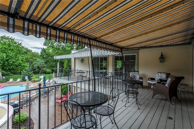 10734 Glenwood St Unit A, Overland Park, KS 66211 - wooden terrace with a community pool and a patio