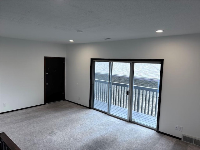 423 W 104th St Unit C, Kansas City, MO 64114 - carpeted empty room featuring recessed lighting and a textured ceiling