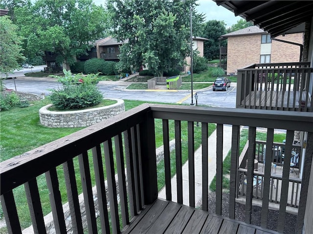 423 W 104th St Unit C, Kansas City, MO 64114 - wooden terrace with a lawn