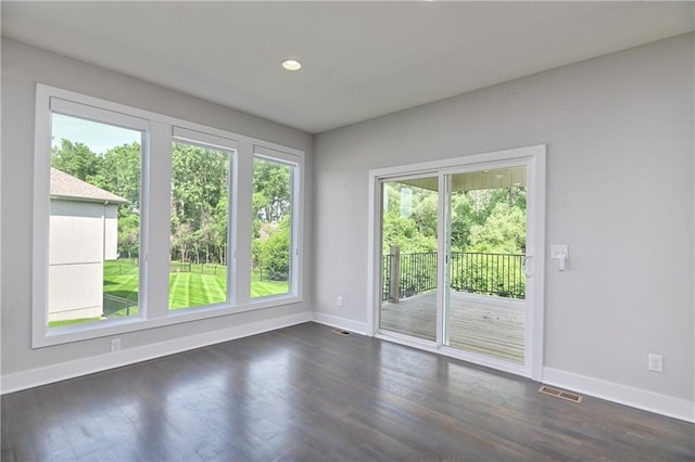 14500 Aurora Ln, Basehor, KS 66007 - spare room featuring dark wood-style flooring and recessed lighting