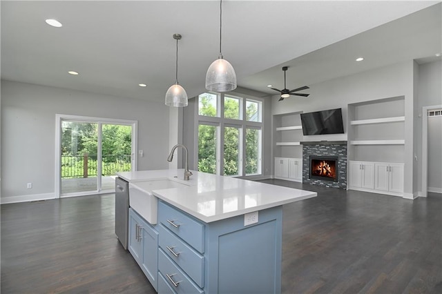 14500 Aurora Ln, Basehor, KS 66007 - kitchen with stainless steel dishwasher, healthy amount of natural light, light countertops, a ceiling fan, and recessed lighting