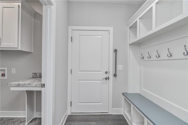 14500 Aurora Ln, Basehor, KS 66007 - mudroom featuring baseboards and dark wood-style floors