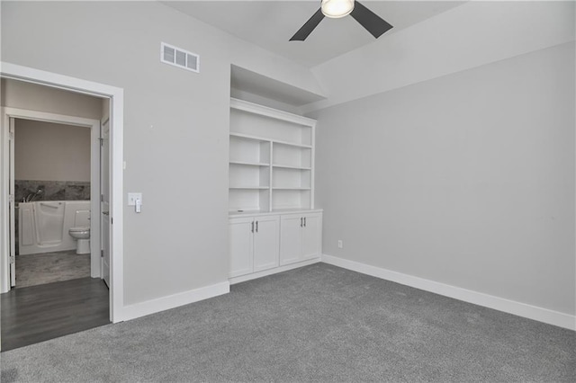 14500 Aurora Ln, Basehor, KS 66007 - empty room featuring dark colored carpet and ceiling fan