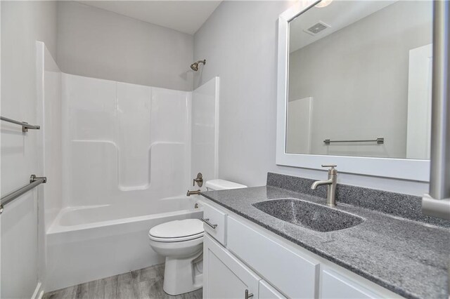 14500 Aurora Ln, Basehor, KS 66007 - full bath featuring vanity, wood finished floors, and bathtub / shower combination