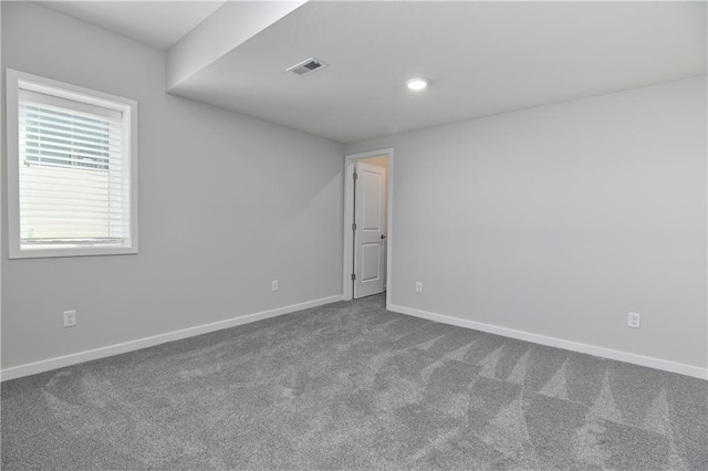 14500 Aurora Ln, Basehor, KS 66007 - spare room featuring dark carpet and recessed lighting