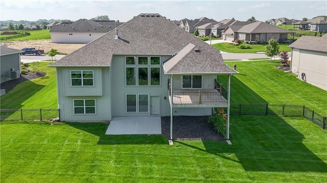 14500 Aurora Ln, Basehor, KS 66007 - rear view of property featuring a patio area, roof with shingles, a fenced backyard, and a residential view